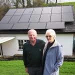Ian and Marian Horsburgh outside their home with the solar panels