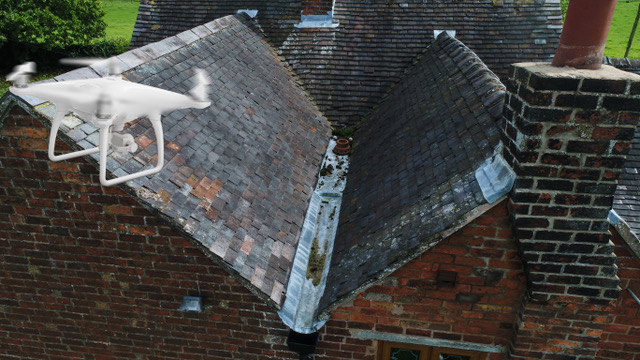Drone inspecting a roof.