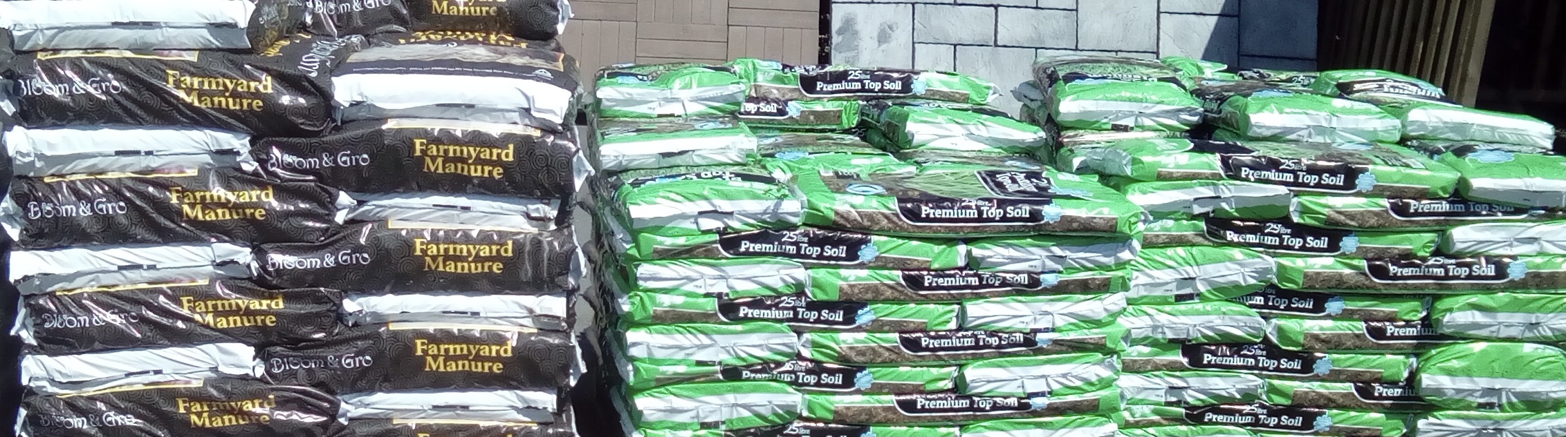 Bags of compost in piles