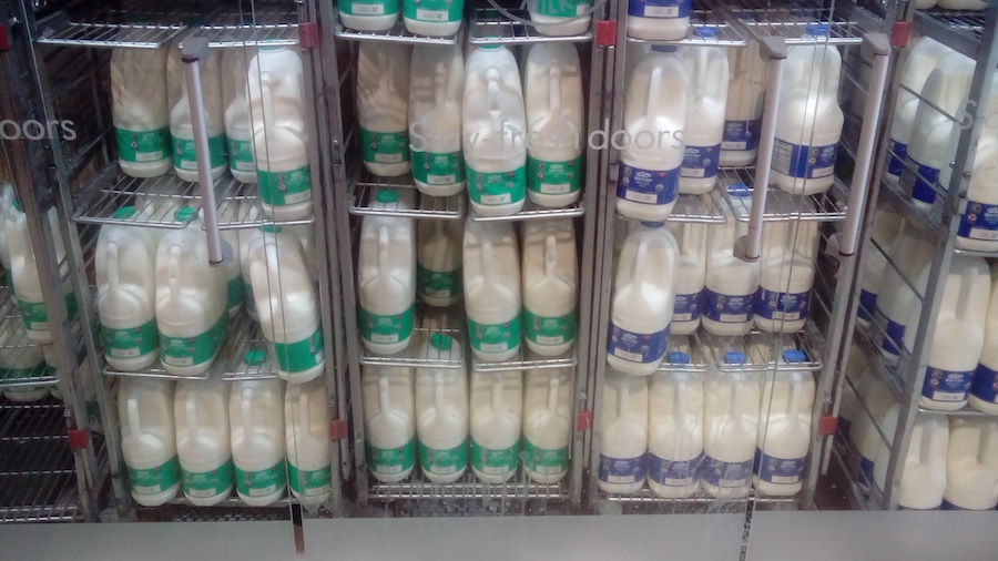 Supermarket milk in a fridge without doors.