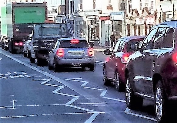Cars in a queue on a busy street