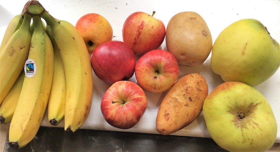 Bananas and Apples on a chopping board