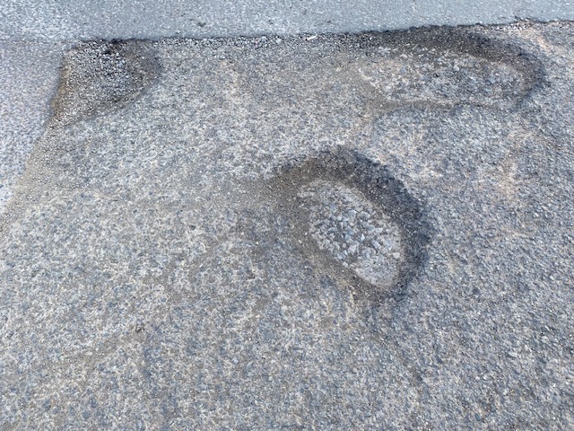 Get out of a hole by bringing in a pothole tax. Picture: John Butterworth