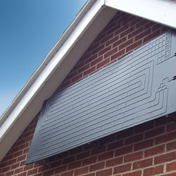 solar-assisted-heat-pump-staffordshire Solar assisted heat pump installed on a wall at a home in Staffordshire